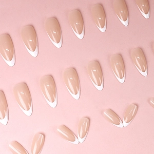 French press-on nails in sheer pink with white tips and long oval shape set