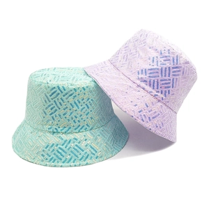 Detail of glitter bucket hats featuring sequined plaid patterns in mint green and lavender