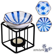 Ceramic aroma burner with blue patterned bowl on a black metal frame with tea light candle