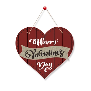 Deep red heart-shaped wooden sign with Happy Valentine's Day text and linen banner