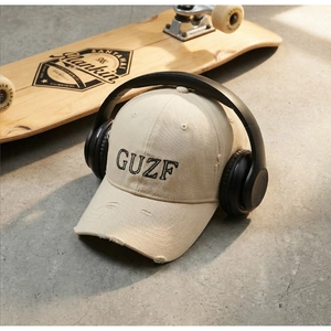 Detail of vintage baseball cap with GUZF 3D embroidery and distressed ripped accents