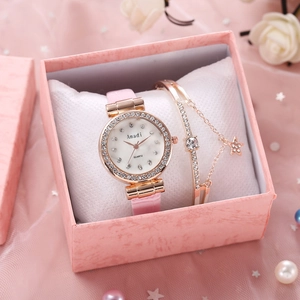 Coffret montre femme or rose avec lunette en strass et bracelet étoile assorti
