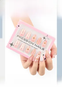 Detail view of pink press-on nails with 3D floral relief and pearl shell textures