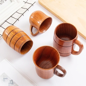Natural jujube wood coffee mug set with handle and barrel cup on a wooden board