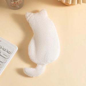 Close-up of soft white plush cat pencil case with fluffy faux fur texture on a warm desk