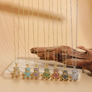 Detail of 14K gold-plated bear necklaces with multicolor zircon stones in various styles