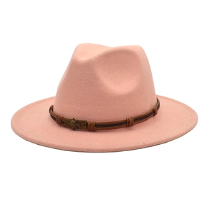 Detailed front view of pink wool fedora hat featuring brown braided leather and skull buckle
