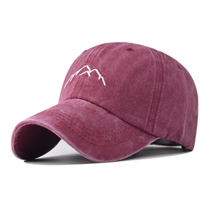 Close-up of white mountain embroidery on washed burgundy vintage baseball cap