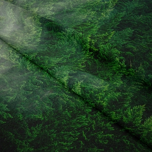 Detailed macro view of the conifer forest digital print texture on high-quality fabric