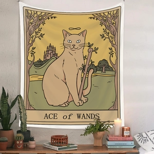 Detail of bohemian cat tarot tapestry featuring Ace of Wands illustration on wall