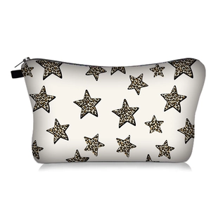 Detail of leopard print star pattern on beige toiletry bag with black zipper closure