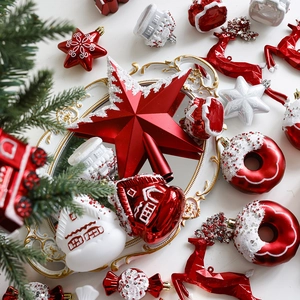 Red Christmas tree topper star and assorted ornaments set including donuts and houses