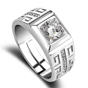 Macro detail of men's adjustable silver ring with center zircon and Greek key pattern.