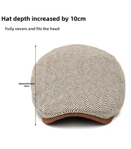 Detail of British style tweed newsboy cap showing 10cm depth and herringbone weave pattern