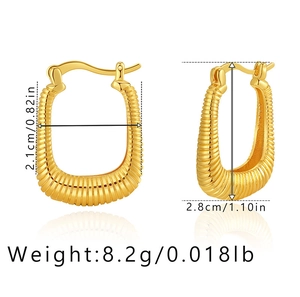 Detailed macro view showing the 18K gold-plated U-shaped earrings with corrugated texture