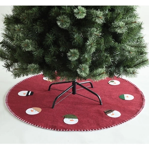Close-up of red wool felt Christmas tree skirt featuring snowman embroidery and white stitching