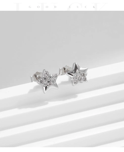 Detailed view of S925 silver star earrings with pave-set sparkling cubic zirconia