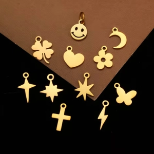 Golden stainless steel DIY charms in shapes of heart, moon, stars, and butterflies