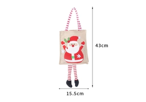 Detail view of burlap Christmas gift bag with Santa doll and 43cm height dimension