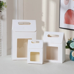 Three white paper gift boxes with transparent windows in small, medium, and large sizes