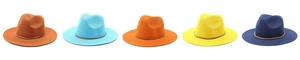 Detail of five colorful woven straw fedora hats with stylish brown leather decorative bands
