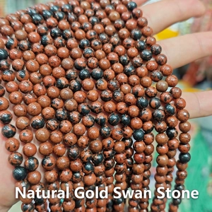 Macro shot of polished red-brown natural stone beads with unique dark patterns