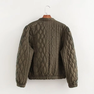 Detailed back view of olive green quilted jacket featuring leaf pattern and elastic hem