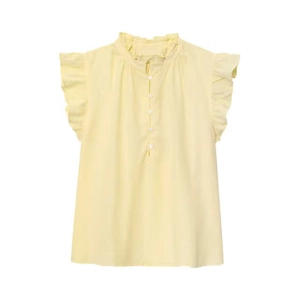 Detail of light yellow sleeveless linen top with ruffled stand collar and elegant texture