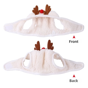Detail view of white plush Christmas pet cape with reindeer antlers and velcro closure