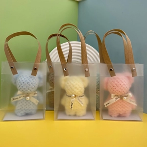 Blue yellow and pink coral fleece towel bears in transparent gift bags with handles