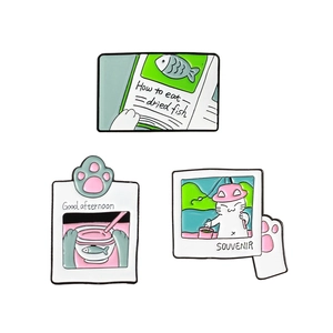 Three cute cartoon cat enamel pins featuring fishing and tea time themes on white background