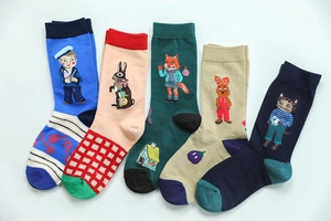 Flat lay of five cotton ankle socks featuring cute animal jacquard fairy tale patterns