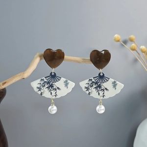 Detail of Chinese style fan earrings with bamboo ink painting and white pearls