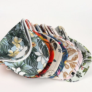 Collection of baseball caps featuring tropical coconut tree and floral palm prints