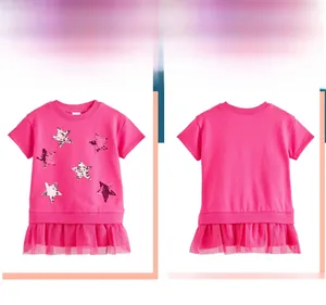 Flat view of girls pink t-shirt dress featuring sequin stars and mesh hem detail