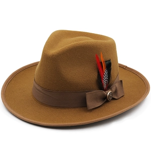 Classic mustard wool fedora hat with brown ribbon and colorful feather accent