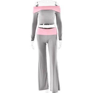 Detail of grey and pink two-piece set featuring off-shoulder top and flared trousers