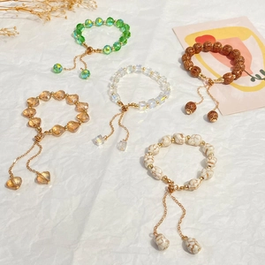 Chic colorful crystal beaded bracelets with adjustable gold chain on white background