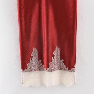 Elegant red satin midi skirt with delicate white lace trim detail for a minimalist look