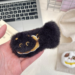 Cute black plush brooch with embroidered smiling face detail for bags and clothes