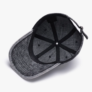Deep grey washed cotton baseball cap showing internal structure and adjustable metal buckle