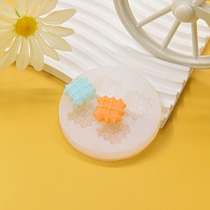 Translucent silicone mold for waffle shaped cookies and desserts on yellow background