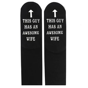Men's cotton socks in black featuring white letters and arrows on the non-slip sole