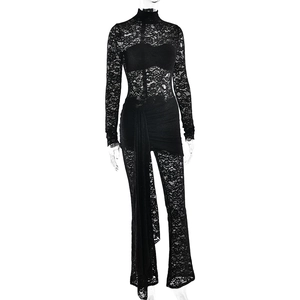 Detail showing the sheer floral lace fabric and ribbon texture on the black bodysuit