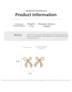 Detail view showing dimensions of gold-plated bow earrings with cubic zirconia