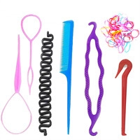 Detail of pink and blue plastic hair styling tools set with tail comb and hair pull pins