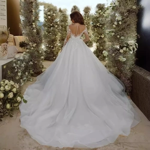 Luxury off-shoulder lace wedding dress with long sleeves and cathedral train for brides