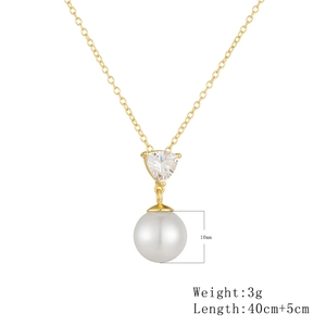 Detail showing 10mm white pearl and triangular zircon pendant on a gold necklace