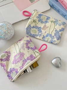 Floral canvas zipper pouch for cosmetics and coins with vibrant magenta rope handle