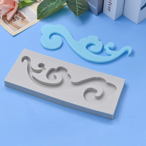 Cloud pattern silicone mold for DIY baking and cake decoration on blue background